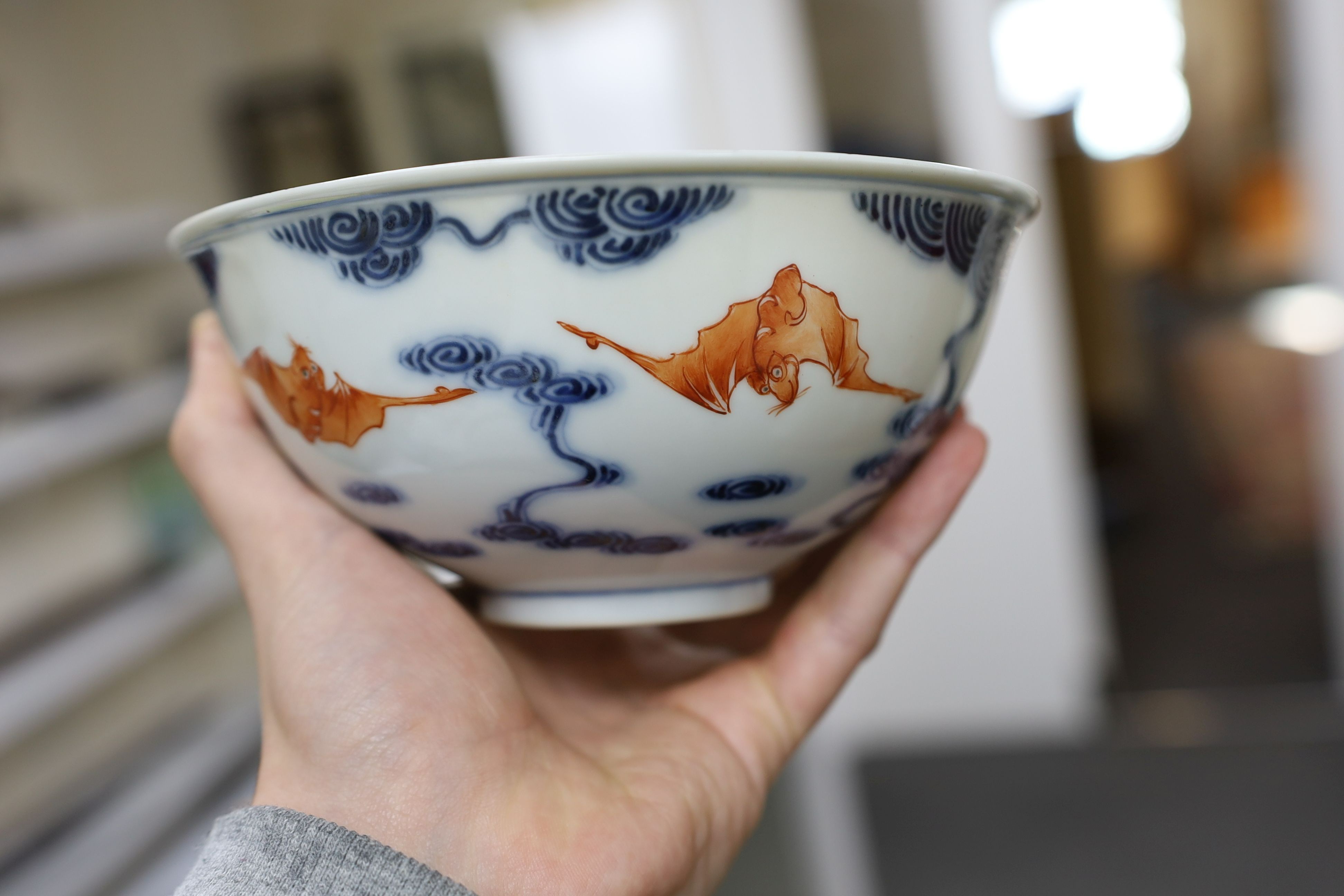 A pair of Chinese iron red and underglaze blue ‘five bat’ bowls, Guangxu mark and probably of the period (1875-1908), 16.5cm diameter